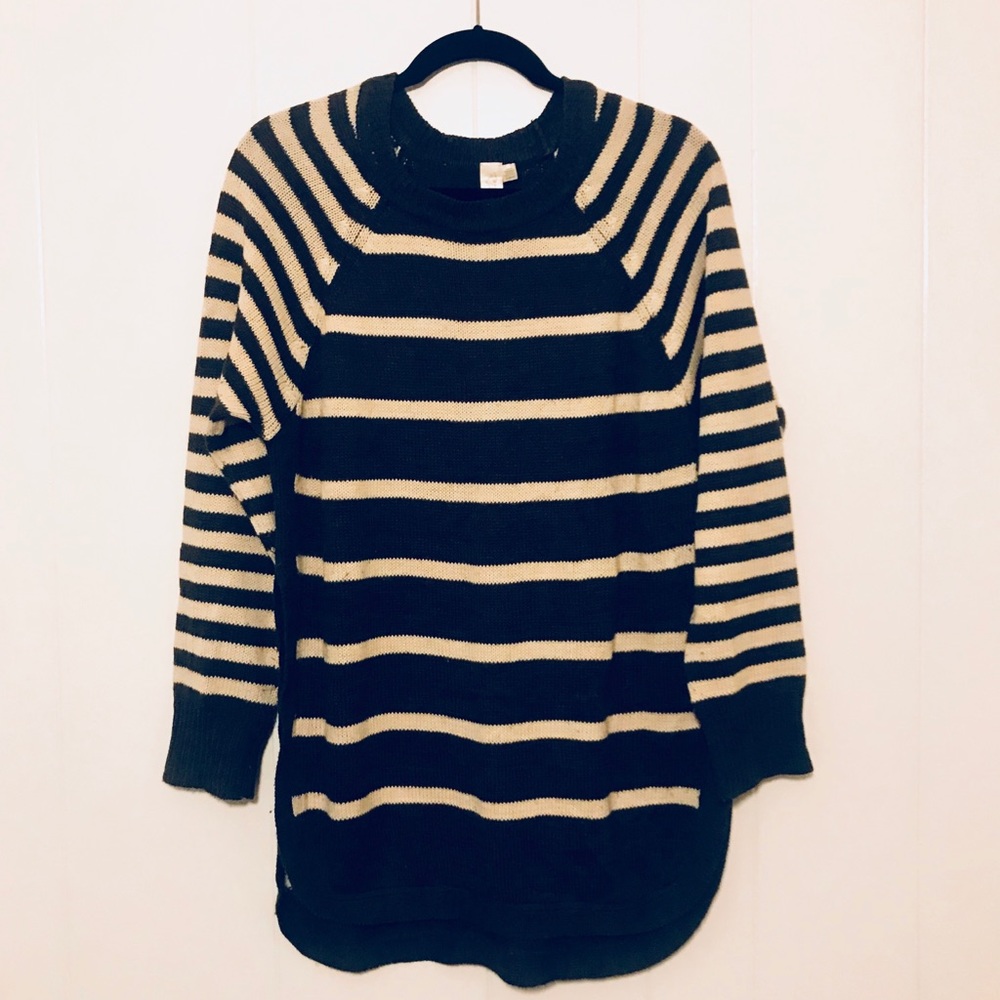 Long sweater with intentional slits up to waist.